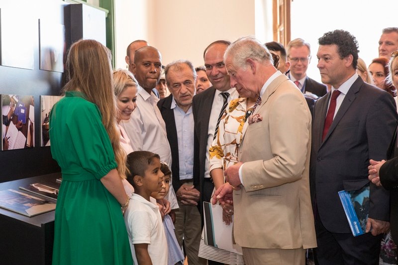 photo of Charles, Prince of Wales and refugee child